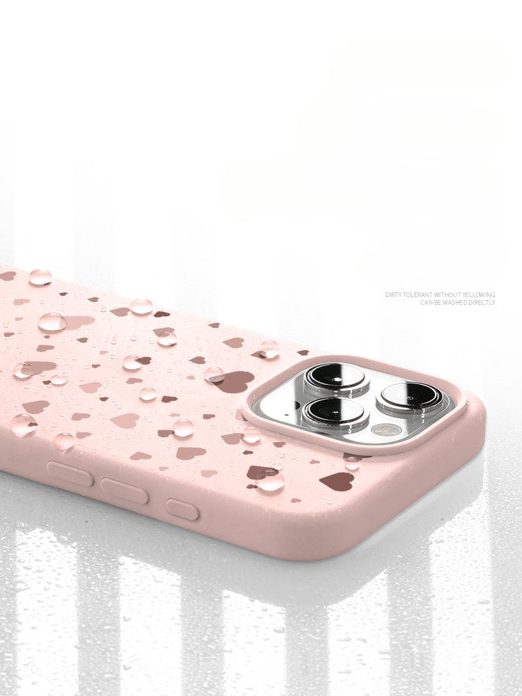 Close-up of a pink iPhone 16 Pro Max Case - Soft Liquid Silicone Protective Cover with water droplets on its surface, highlighting its waterproof feature and dust-resistant material.