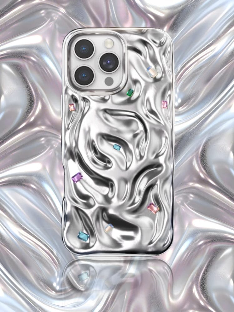 The iPhone 16 Pro Max Luxury Case, crafted with PC material and featuring N52 magnets, showcases a metallic, fluid-like design with handcrafted gemstone detailing and vibrant gem accents. It provides dual-layer protection against a matching metallic background.
