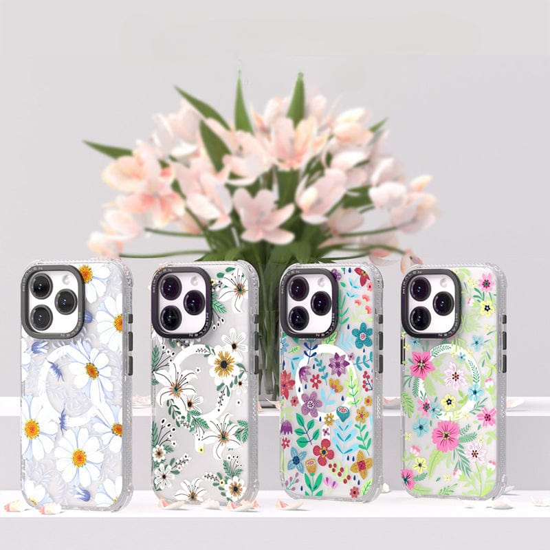Four Floral MagSafe iPhone 16 Pro Max Cases, featuring shockproof TPU + PC construction and elegant 3D flower designs, are displayed in front of a bouquet of pink flowers.