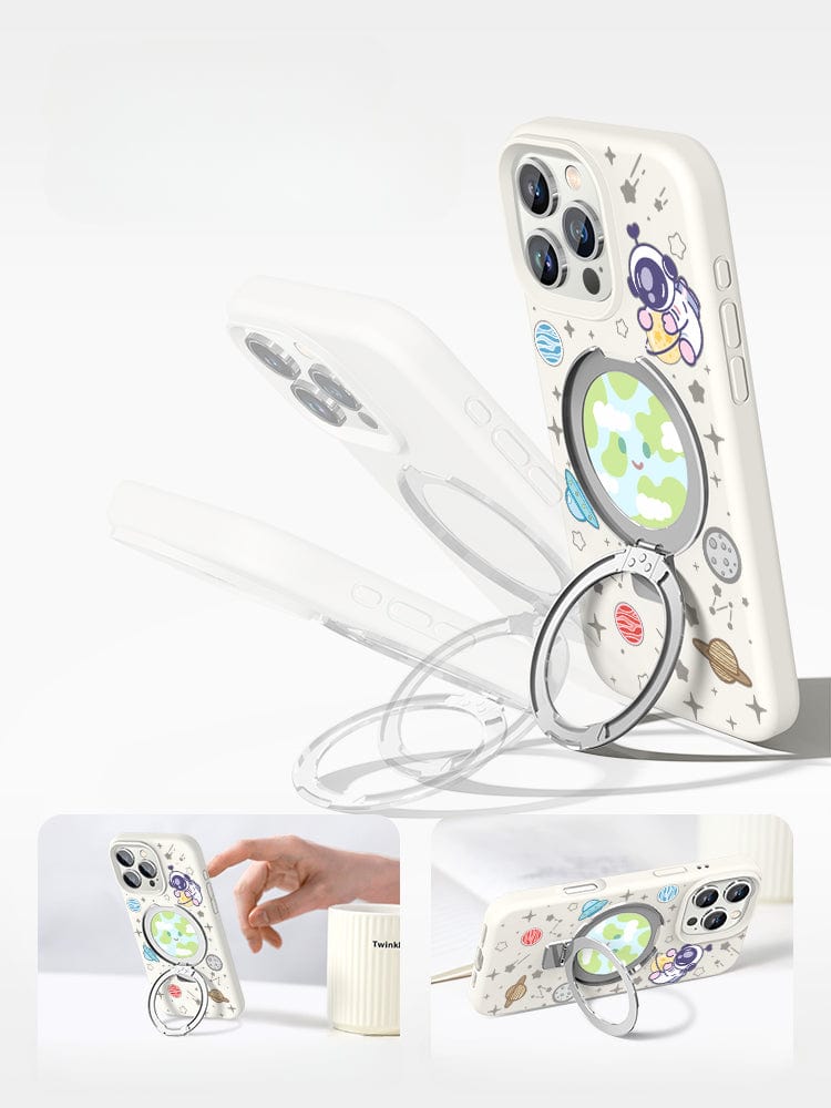 An iPhone 16 Pro Max in a Pink Silicone MagSafe Case with Stand, featuring a space theme complete with planets and stars, rests in an open beige box with an additional slot for another phone or accessory.