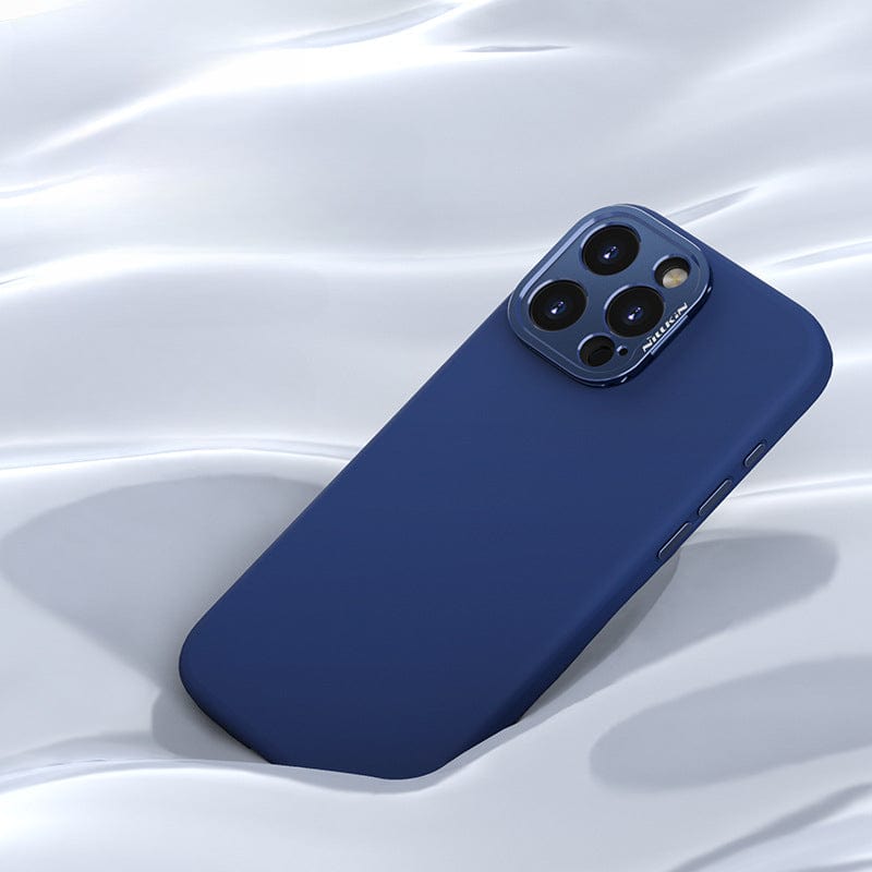 A blue iPhone 16 Pro Max featuring a triple-camera setup is placed on a smooth, white surface, encased in an eco-friendly MagSafe-compatible liquid silicone case with a grip and aluminum camera kickstand.