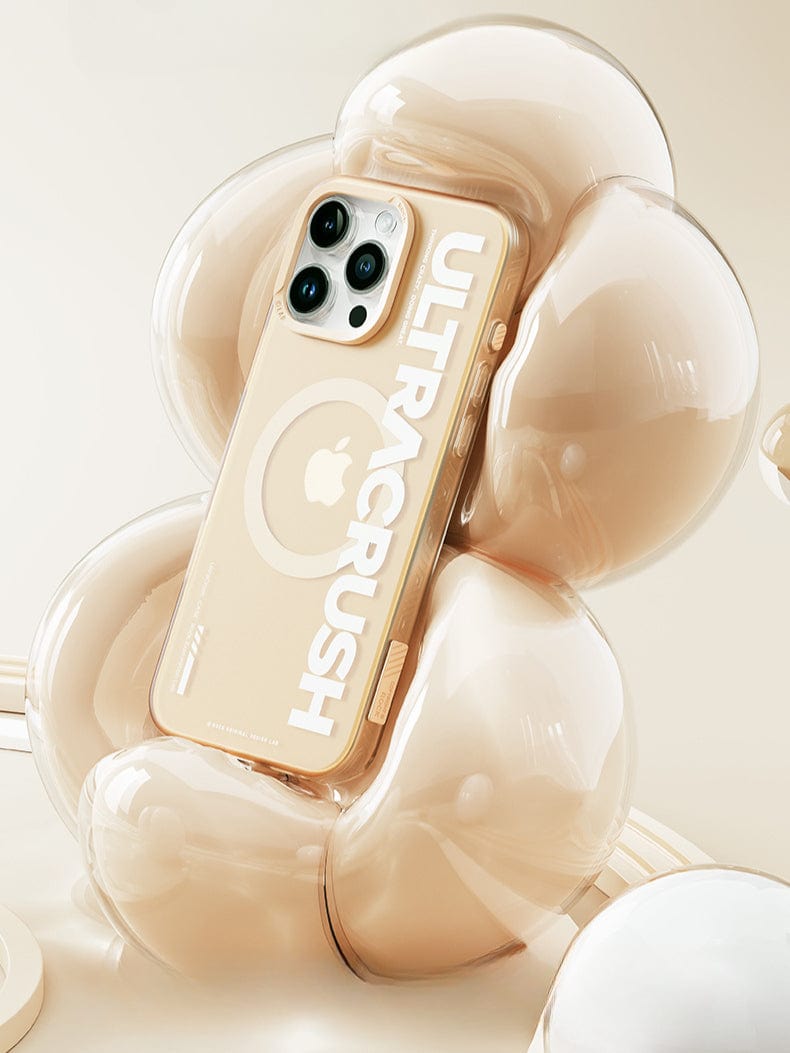 A cream-colored smartphone encased in an UltraSleek Clear Case for the iPhone 16 Pro Max, featuring magnetic wireless charging and shockproof 5-layer protection, floats in the center of an abstract, translucent, flower-shaped cushion. The words "ULTRACRUSH" are printed on the back of the phone case, highlighting its sleek design.