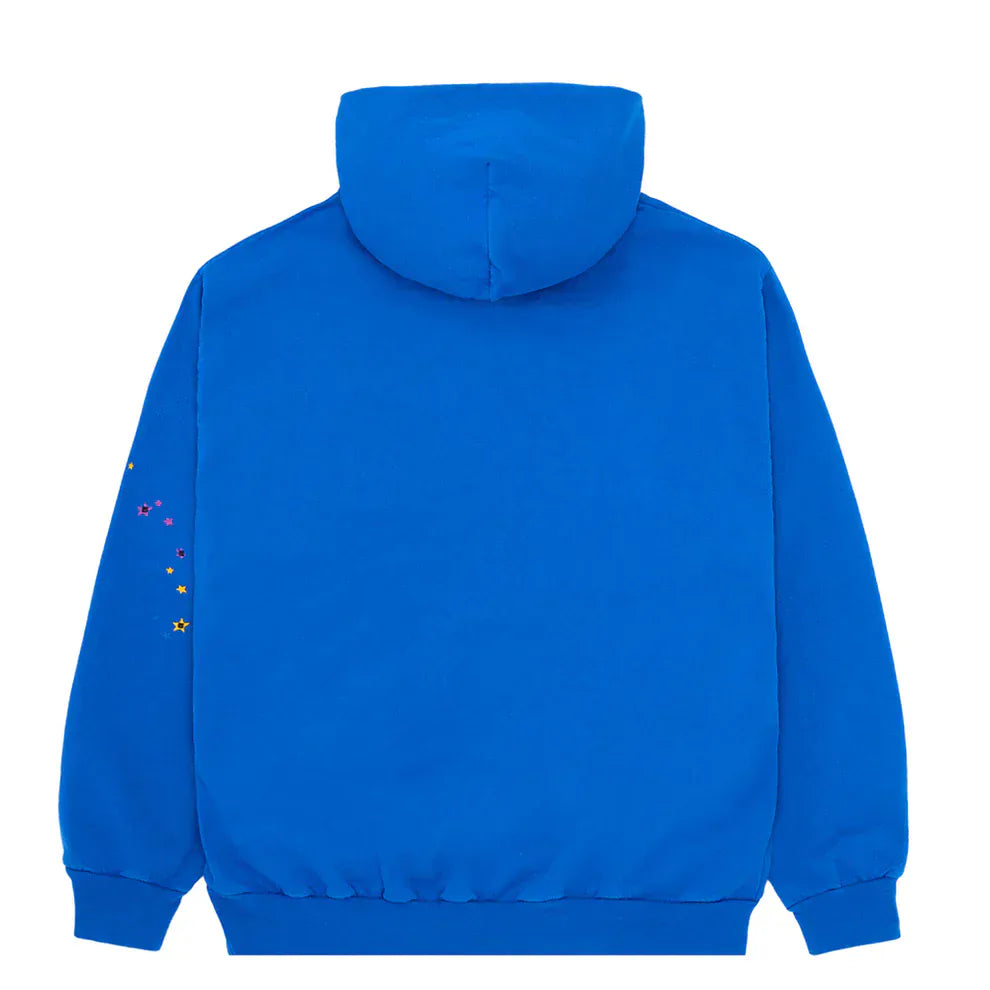 The Sp5der “Hares the Slime” Hoodie (440GSM) in Royal Blue features a fuzzy logo spider-web graphic on heavyweight cotton fleece, shown from the back with colorful star designs on the right sleeve for standout streetwear style.