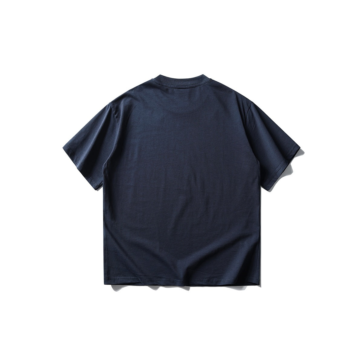 Back view of plain navy short-sleeve crew-neck T-shirt flat lay