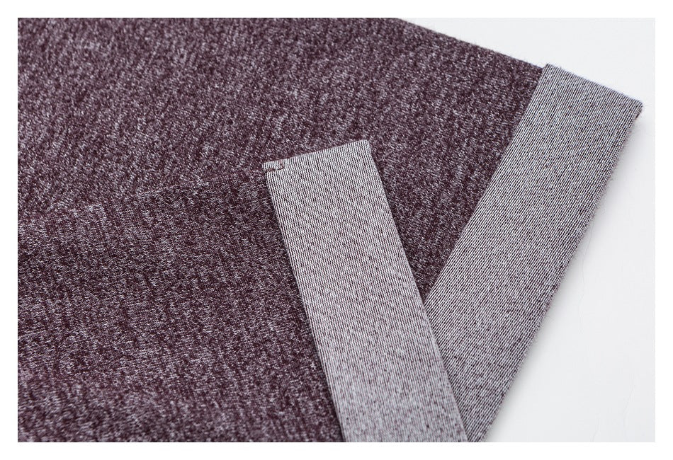Close-up of the burgundy heathered shirt's sleeve and hem edges, showing pale gray reverse fabric.