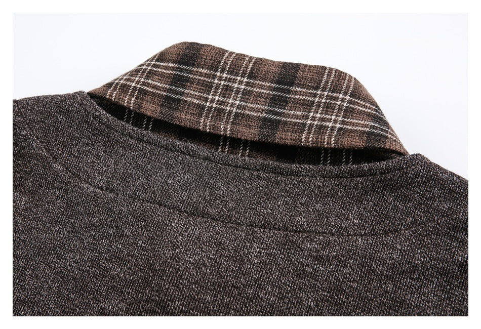 Close-up of the dark brown jacket's back neckline with a brown and black plaid collar visible.