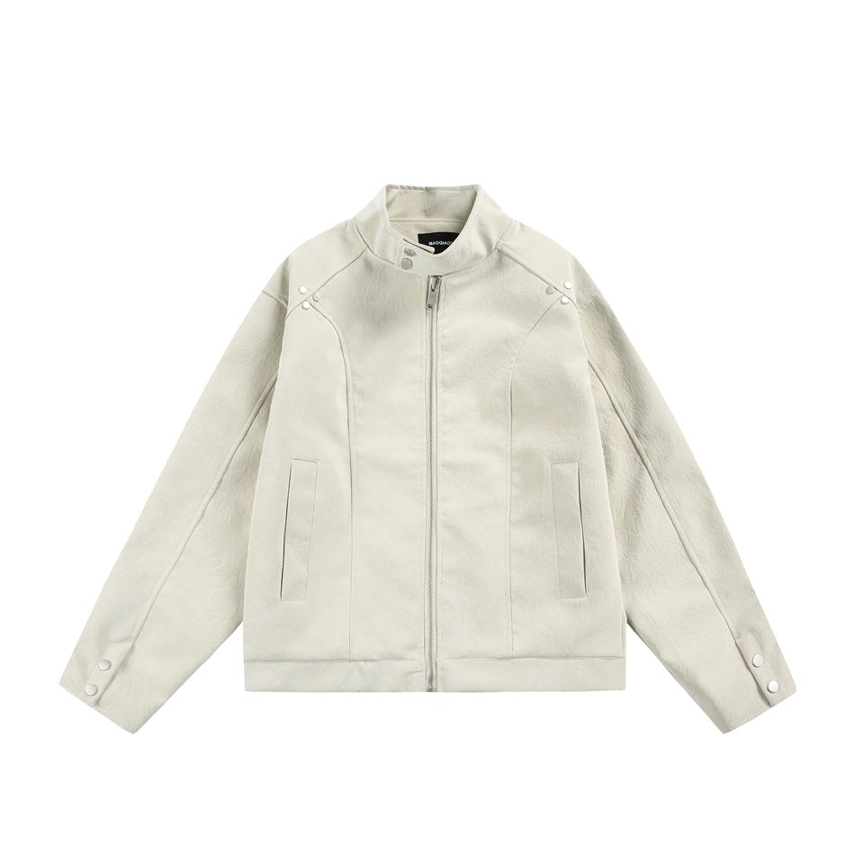 Beige stand-collar zip jacket with a subtle crinkled texture, snap shoulder tabs, snap cuffs and slit front pockets