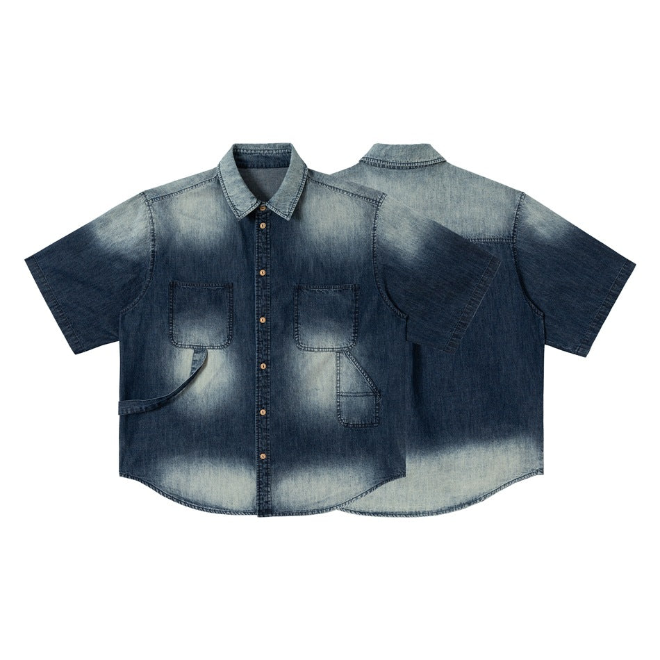 Short-sleeved blue denim button-up shirt shown from the front and back, with chest pockets and faded panels.