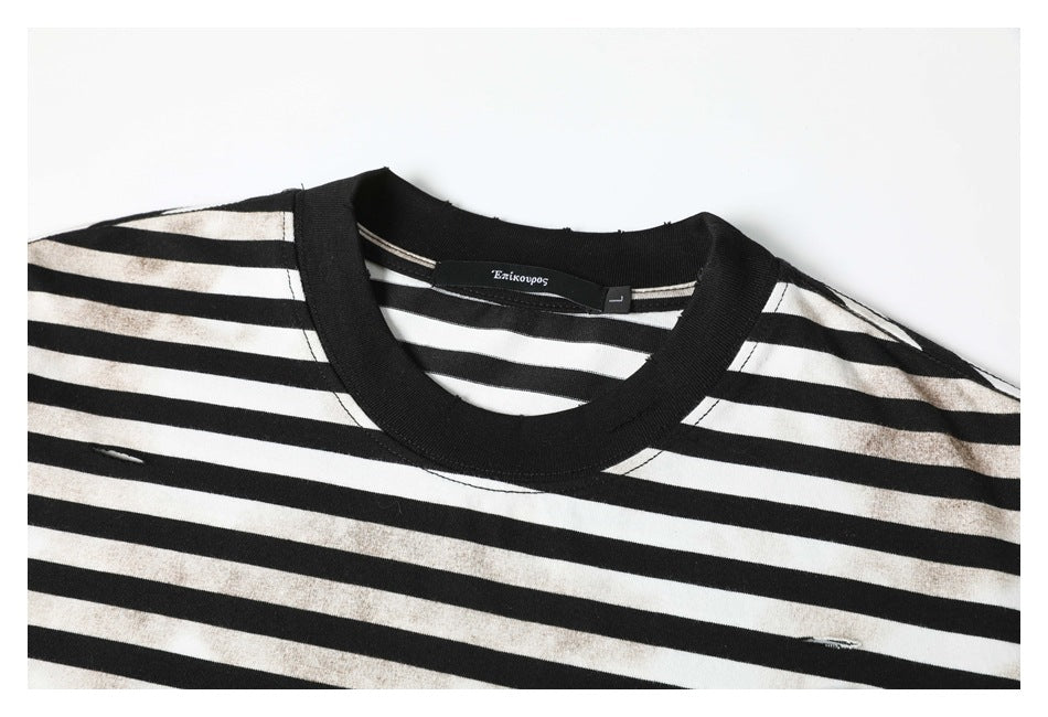 Close-up of the black ribbed neckline and striped upper chest, with faded marks and small distressed slits.
