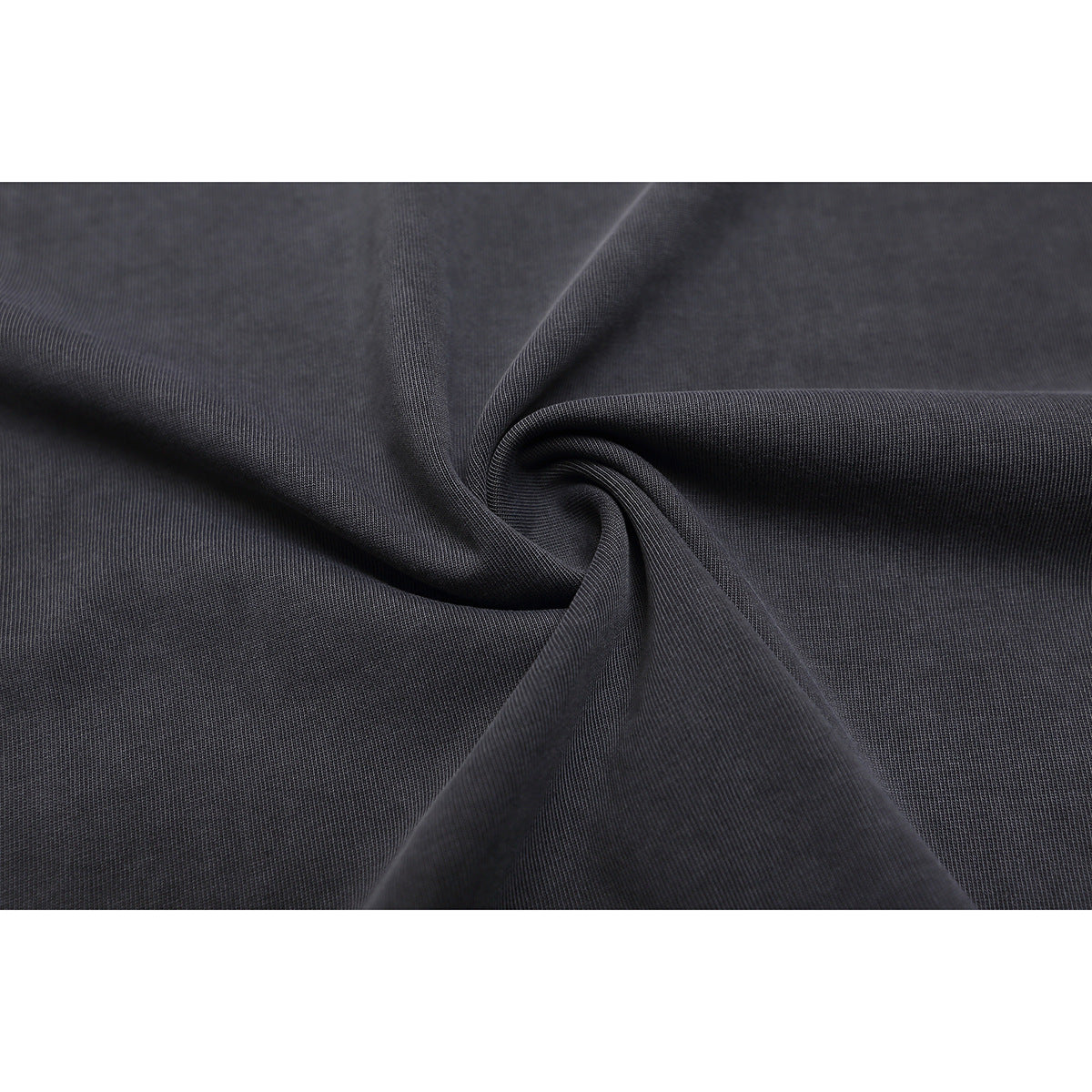 Close-up of charcoal gray knit fabric gathered into folds.