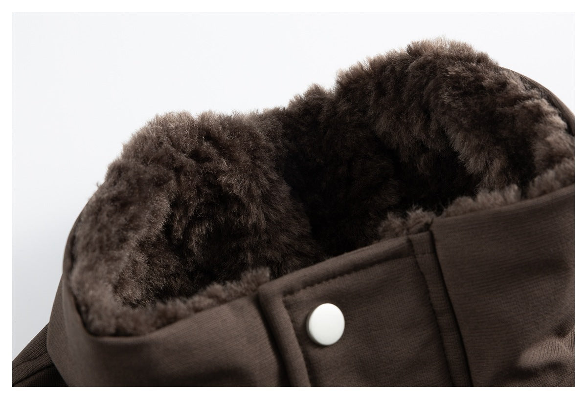 Close-up of the brown jacket's plush collar lining and a white snap on the front tab.