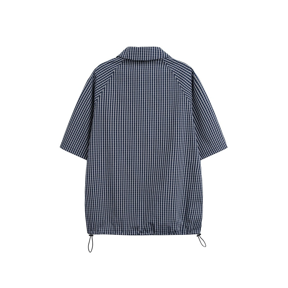 Back view of a navy-and-white checked short-sleeve shirt with an adjustable drawcord hem.