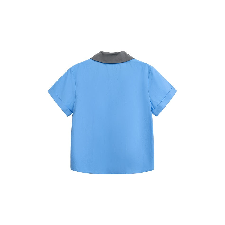 Back view of blue short-sleeve shirt with gray rounded collar and cuffed sleeves on white background