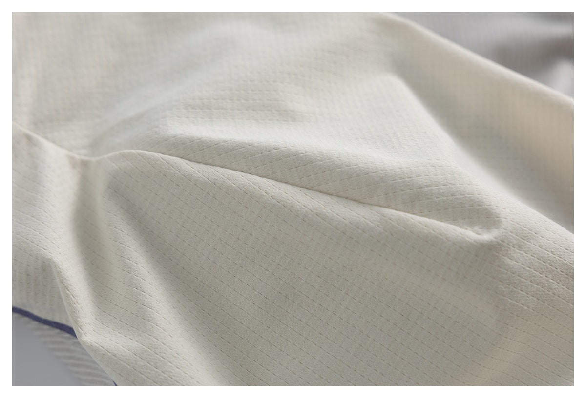 Close-up showing the subtle linear texture of the ivory garment fabric.