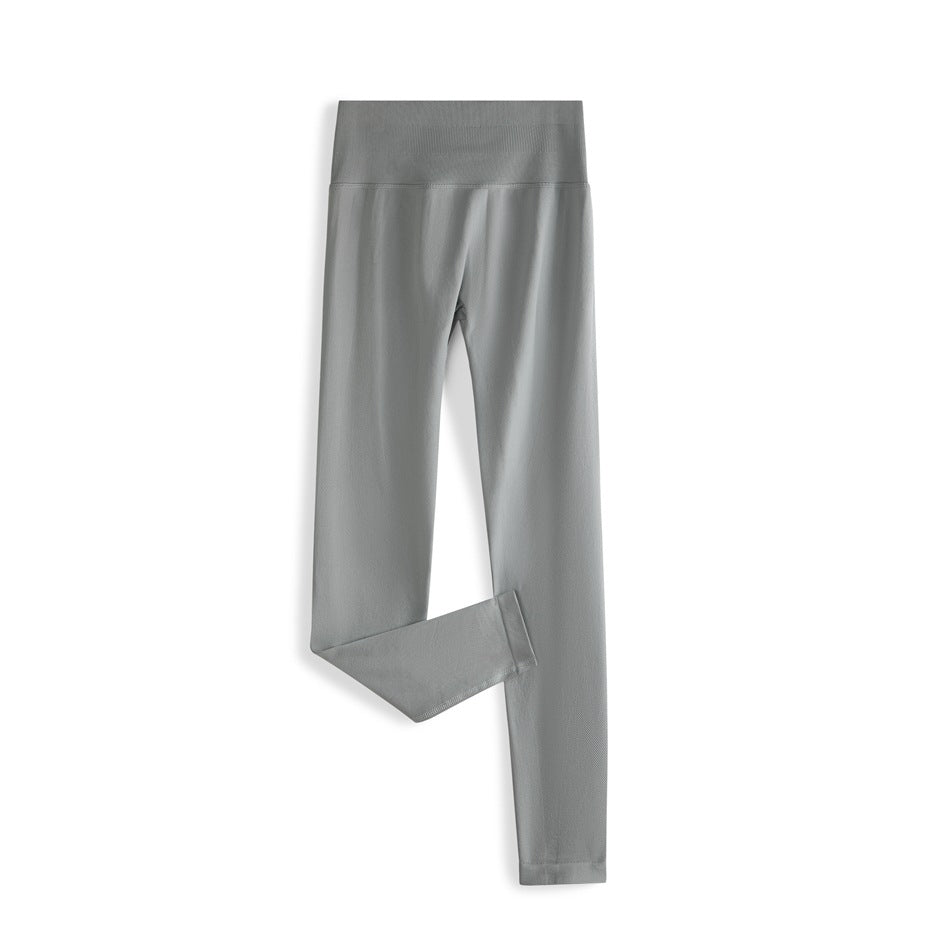 Light gray high-waisted ankle-length leggings laid flat with one leg folded
