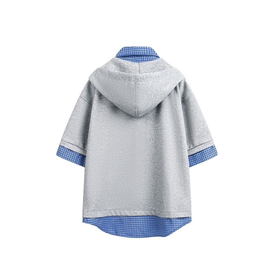 Back view of a light gray short-sleeve hooded top with blue checked fabric at the collar, cuffs, and curved hem.