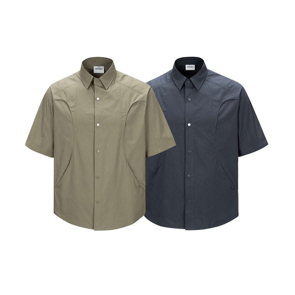 Front views of short-sleeve button-up shirts in olive khaki and dark slate blue.
