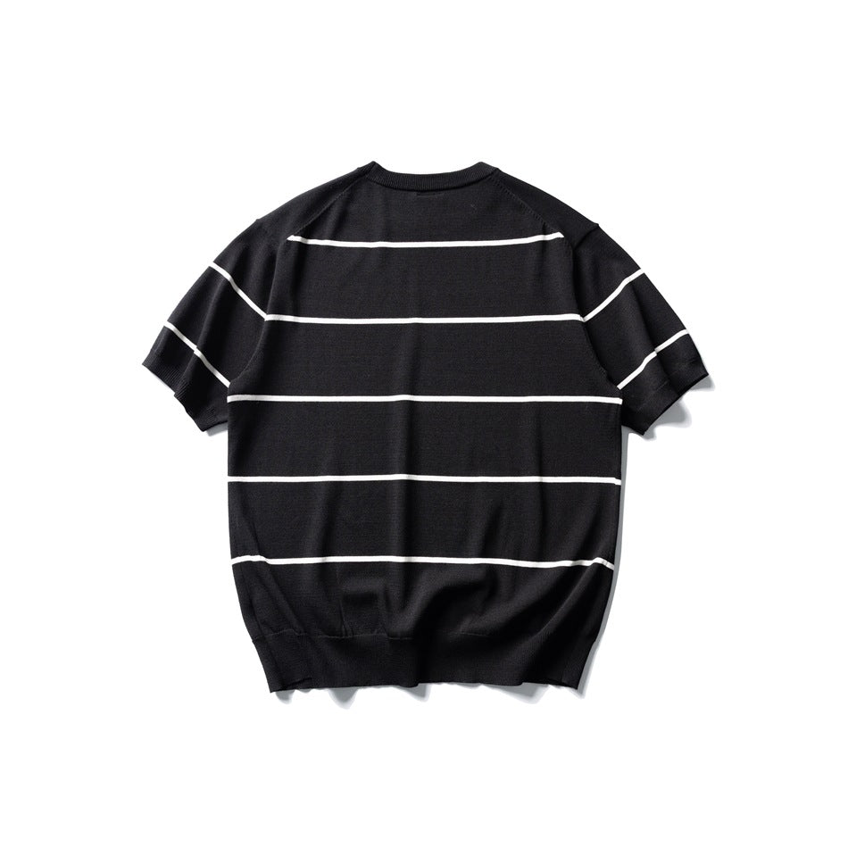 Back view of black short-sleeve knit top with white horizontal pinstripes and ribbed hem, flat lay