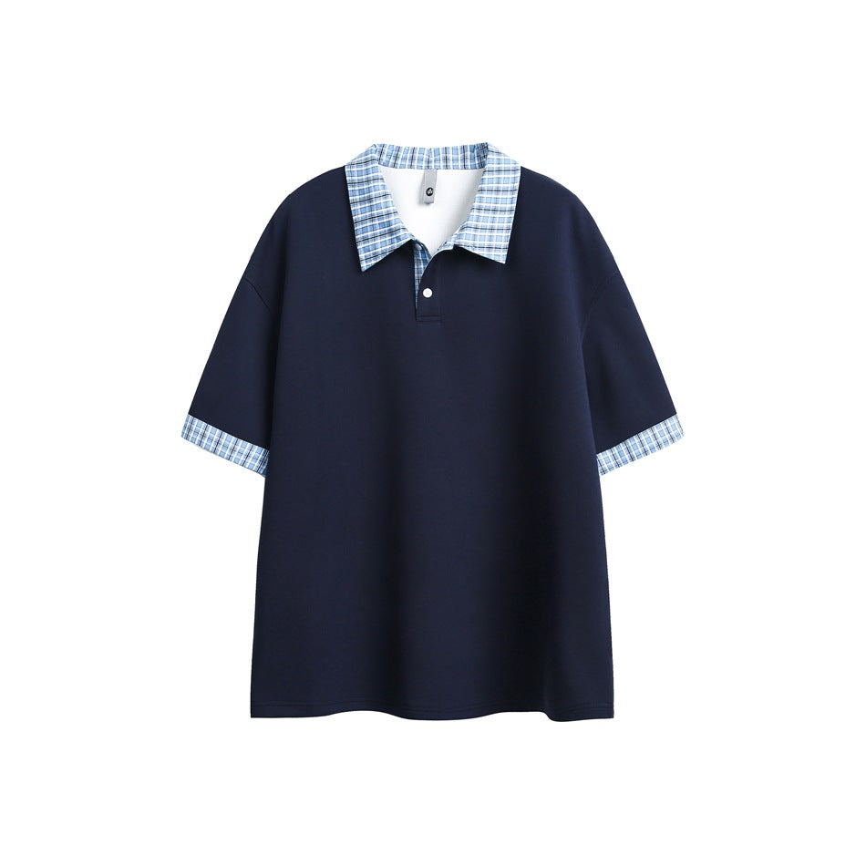 Navy short-sleeve polo with light blue plaid collar and sleeve cuffs, flat lay front view