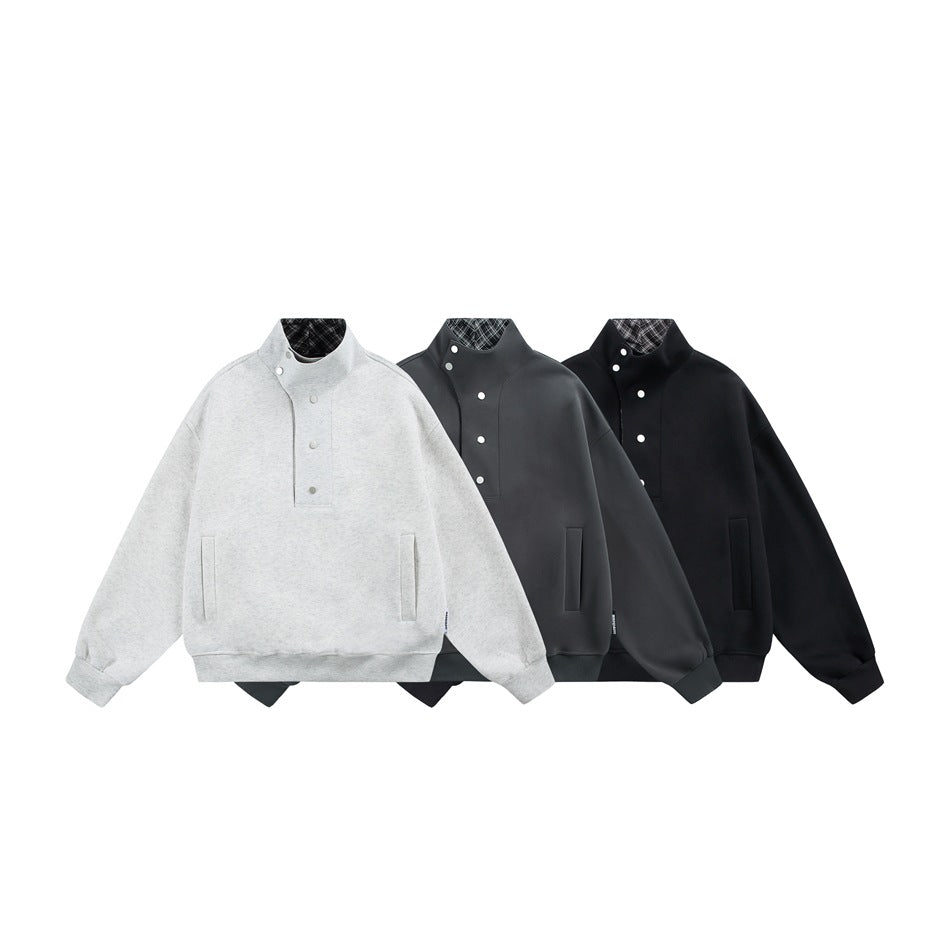 Three snap-placket sweatshirts with stand collars and front pockets in light gray, charcoal, and black.