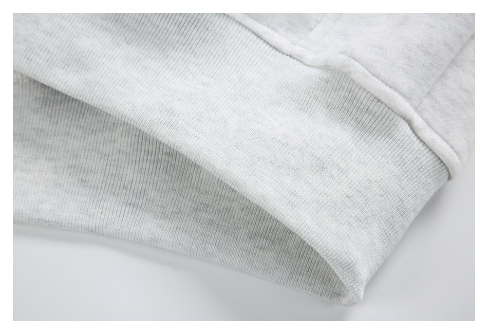 Close-up of the jacket's ribbed hem band and stitched seam.