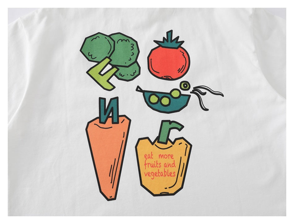 White T-shirt with colorful vegetable illustrations and the words “eat more fruits and vegetables.”