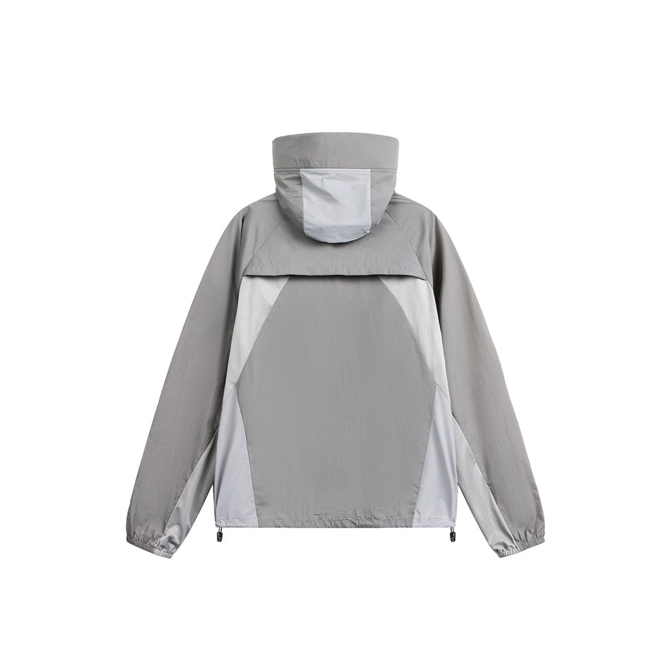 Back view of a gray hooded jacket with pale gray color-block side panels.