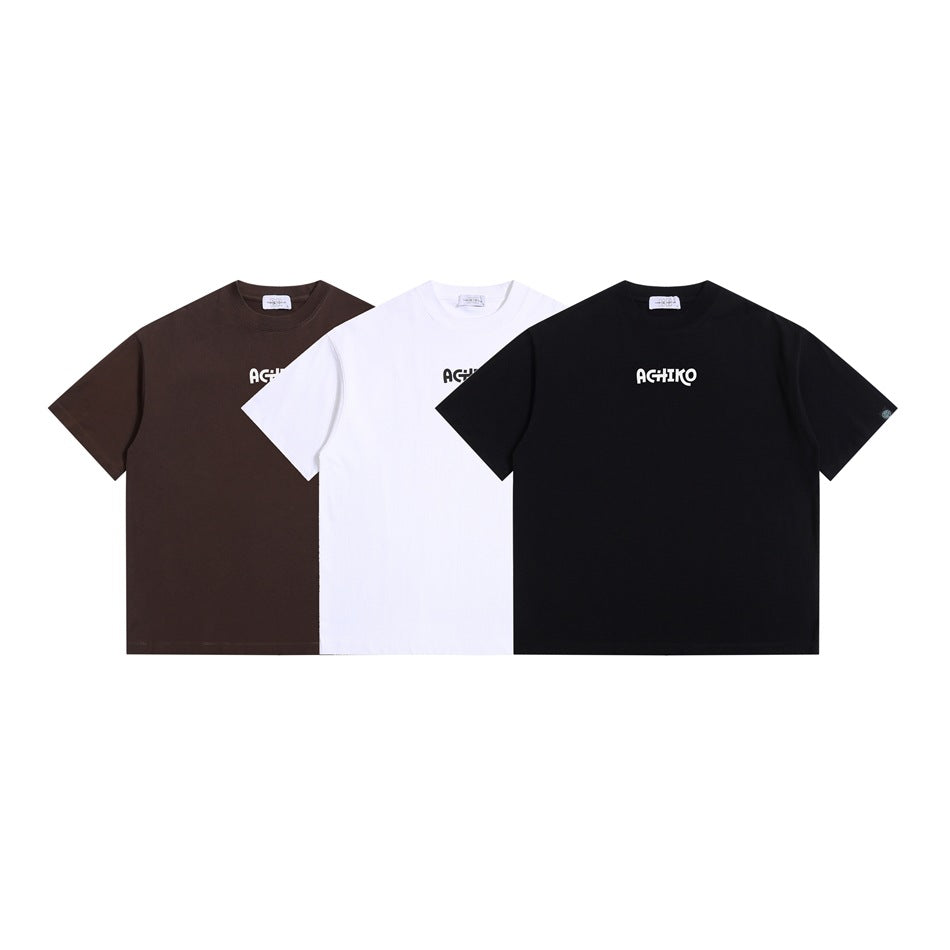 Three short-sleeve crew-neck T-shirts in brown, white, and black, each with a small chest logo.