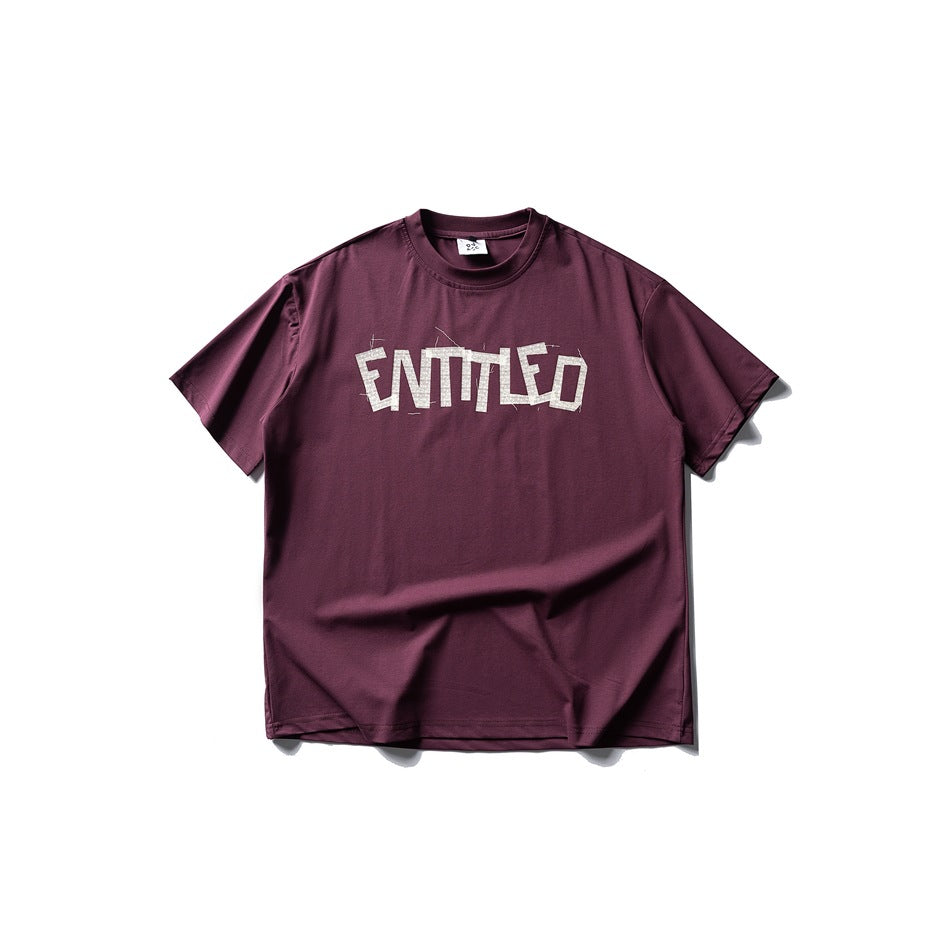 Burgundy short-sleeve crew-neck T-shirt with large pale distressed lettering across the chest.