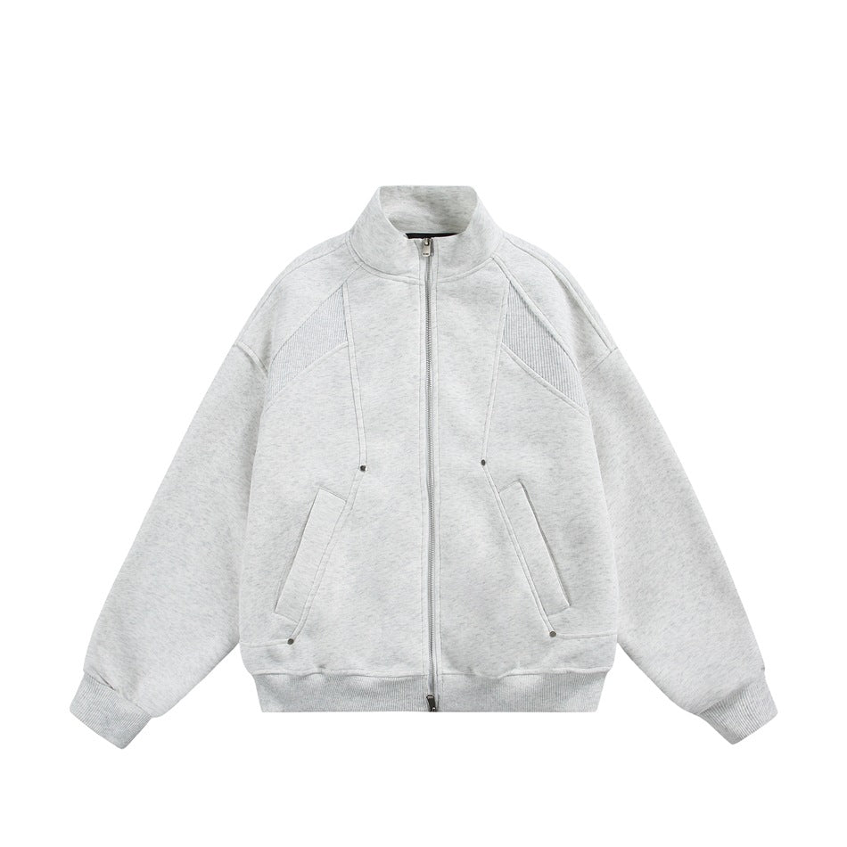 Light gray zip-front stand-collar jacket flat lay with ribbed cuffs, shoulder panels and slanted pockets