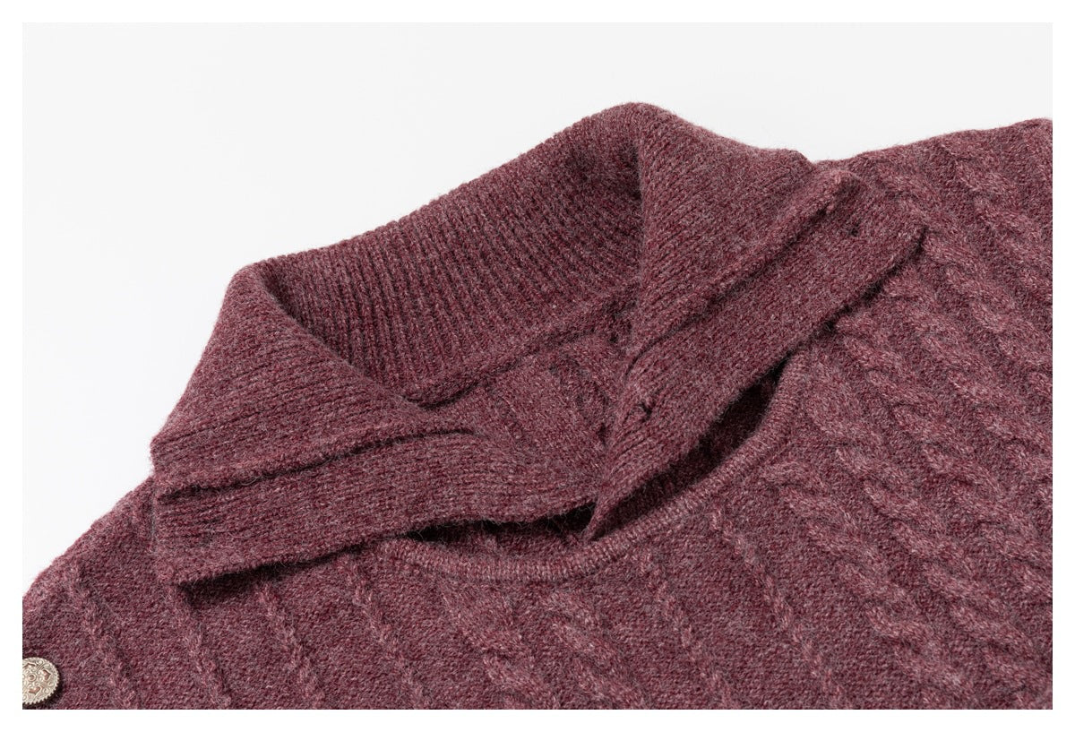 Angled close-up of a burgundy sweater's folded ribbed collar and textured knit.