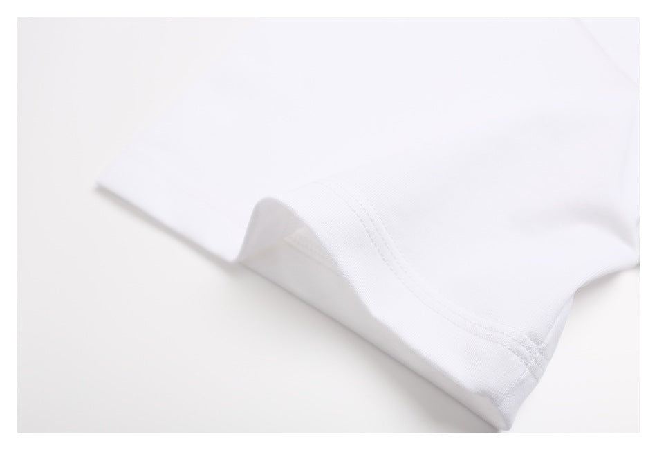 Close-up of the white T-shirt's double-stitched sleeve hem.