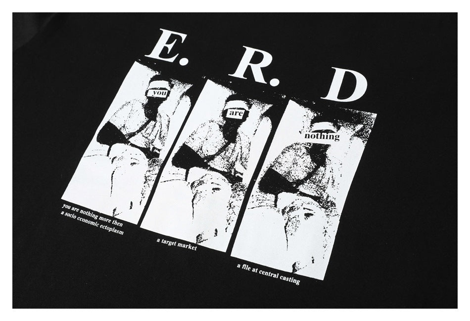 Close-up of a black T-shirt's white E.R.D. print, featuring three monochrome panels and English text.