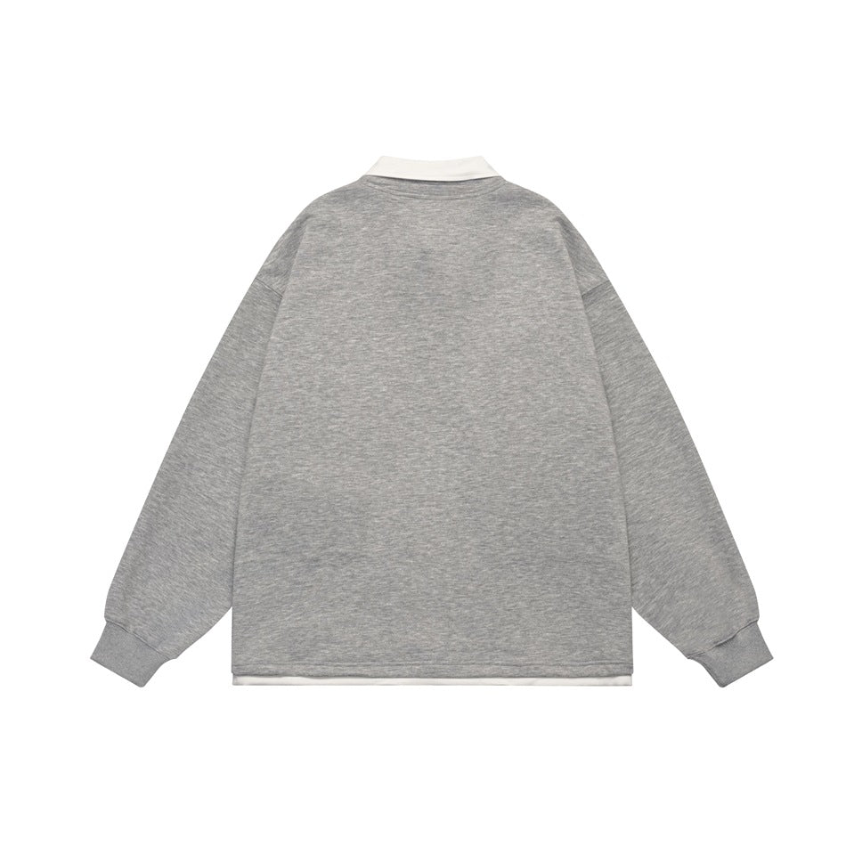 Back view of a heather gray long-sleeve pullover with a white collar and a white layer peeking below the hem.