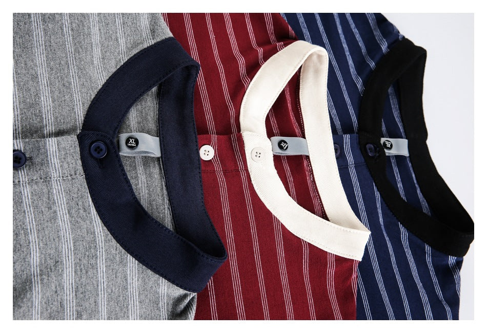 Close-up of gray, burgundy, navy, and black striped tees showing contrasting collars, plackets, and size tags.