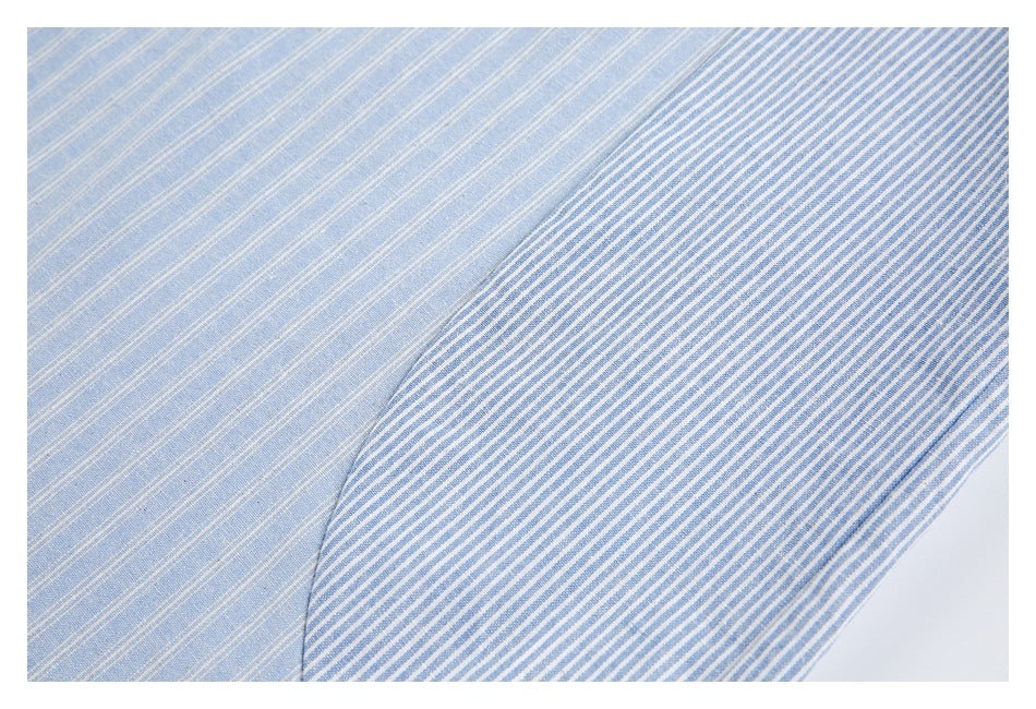 Close-up showing light blue fine-striped fabric beside a contrasting blue-and-white striped panel.