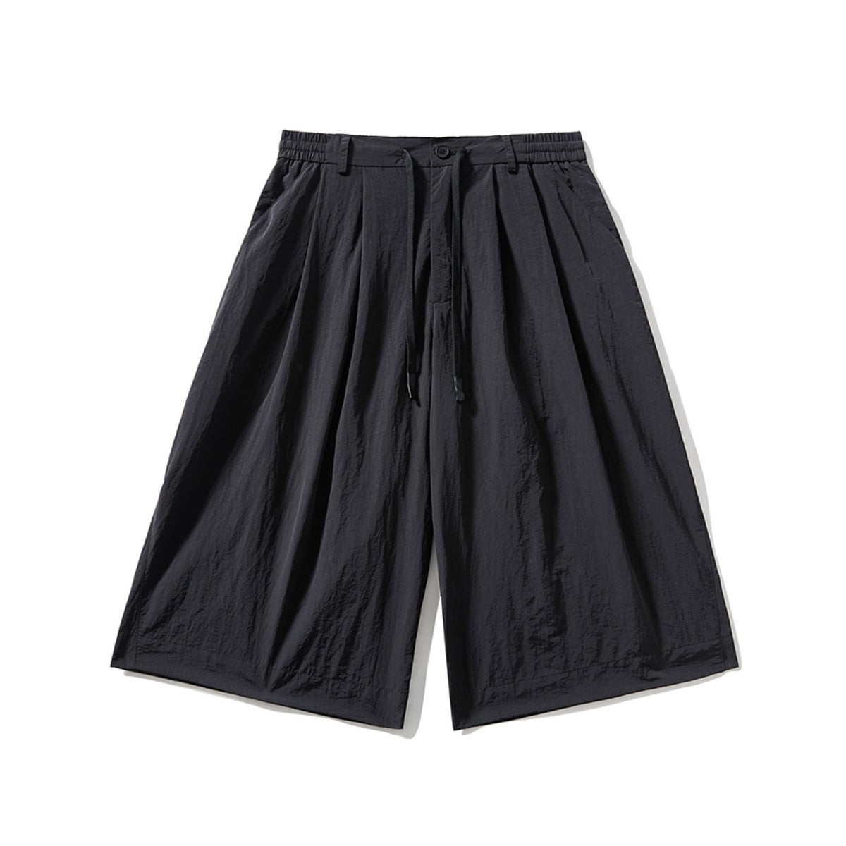 Black wide-leg pleated knee-length shorts with elastic waistband and drawstring, front flat lay