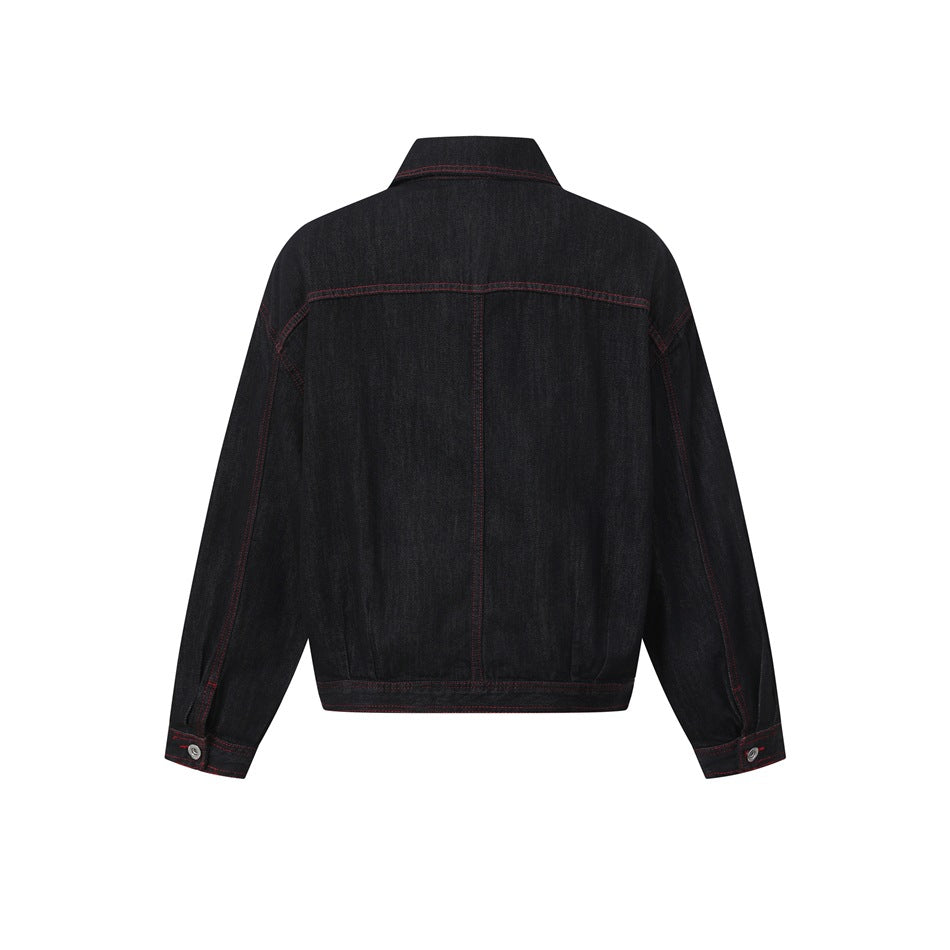 Back view of a black jacket with long sleeves, a pointed collar, and red contrast stitching, shown against white.