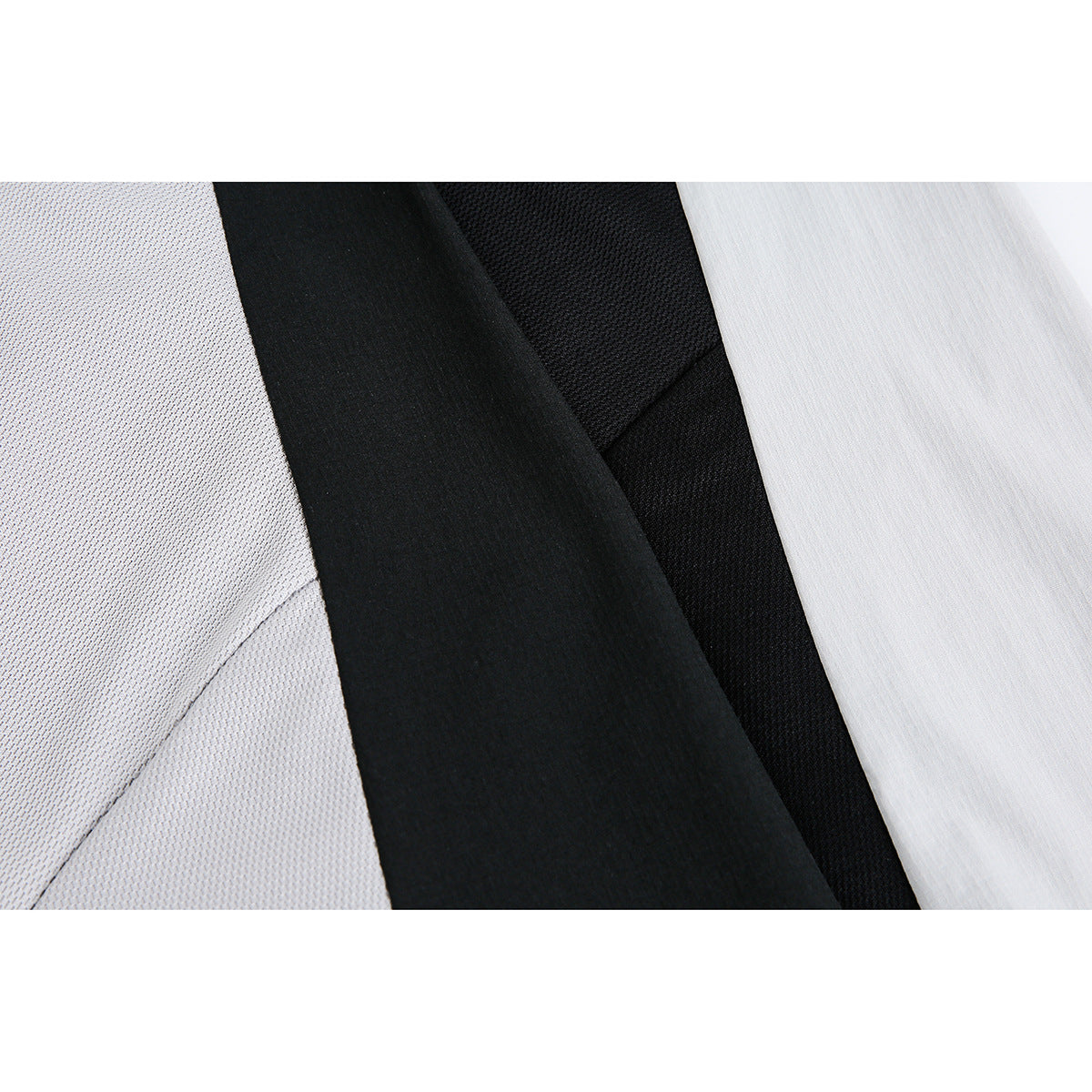 Close-up of black and light gray fabric panels with visibly different surface textures.
