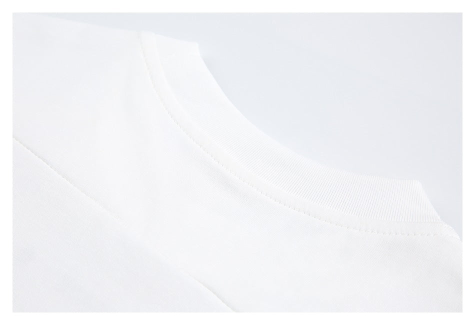 Close-up of a white crew neckline with a ribbed collar.