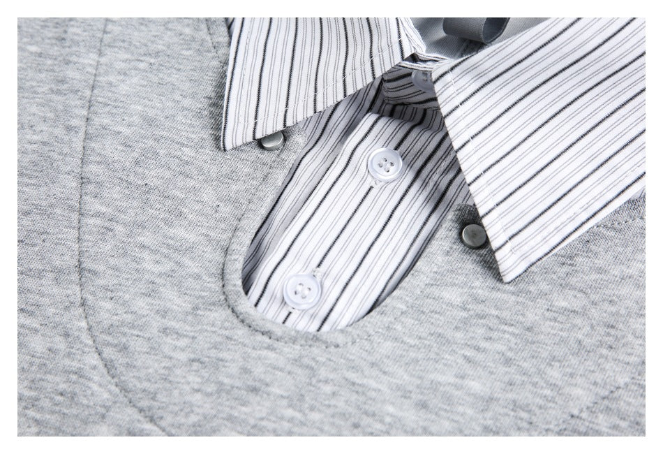 Close-up of the striped button placket and collar on a gray top.
