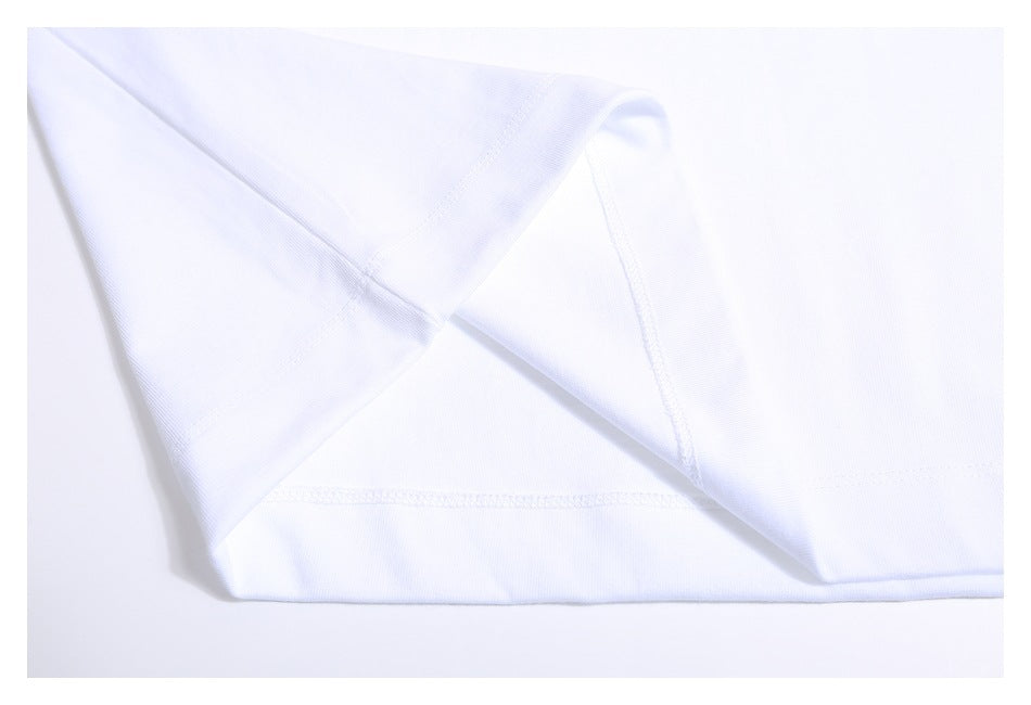 Close-up of the white T-shirt hem and interior stitching.