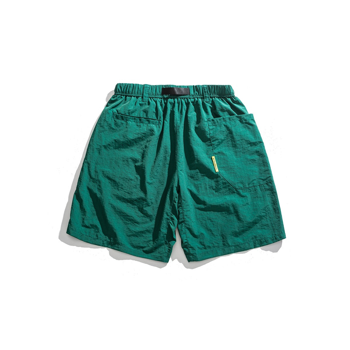 Back view of teal shorts with an elastic waistband, belt loop, and two rear pockets.