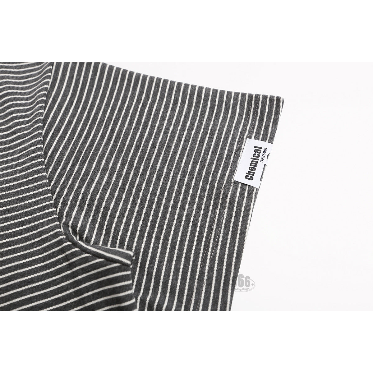 Close-up of the striped T-shirt sleeve with a small white side label.