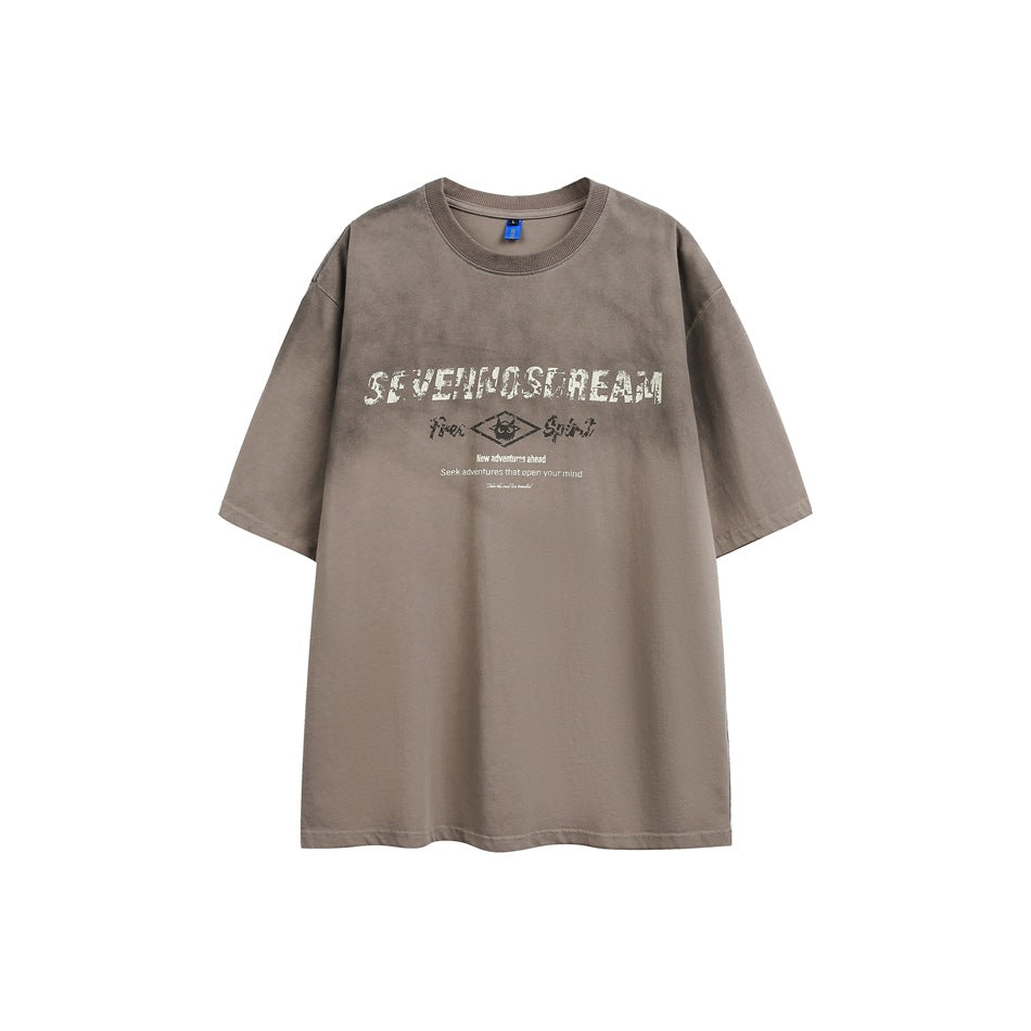 Khaki-brown faded-wash short-sleeve crewneck T-shirt flat lay with cream distressed lettering and diamond emblem print
