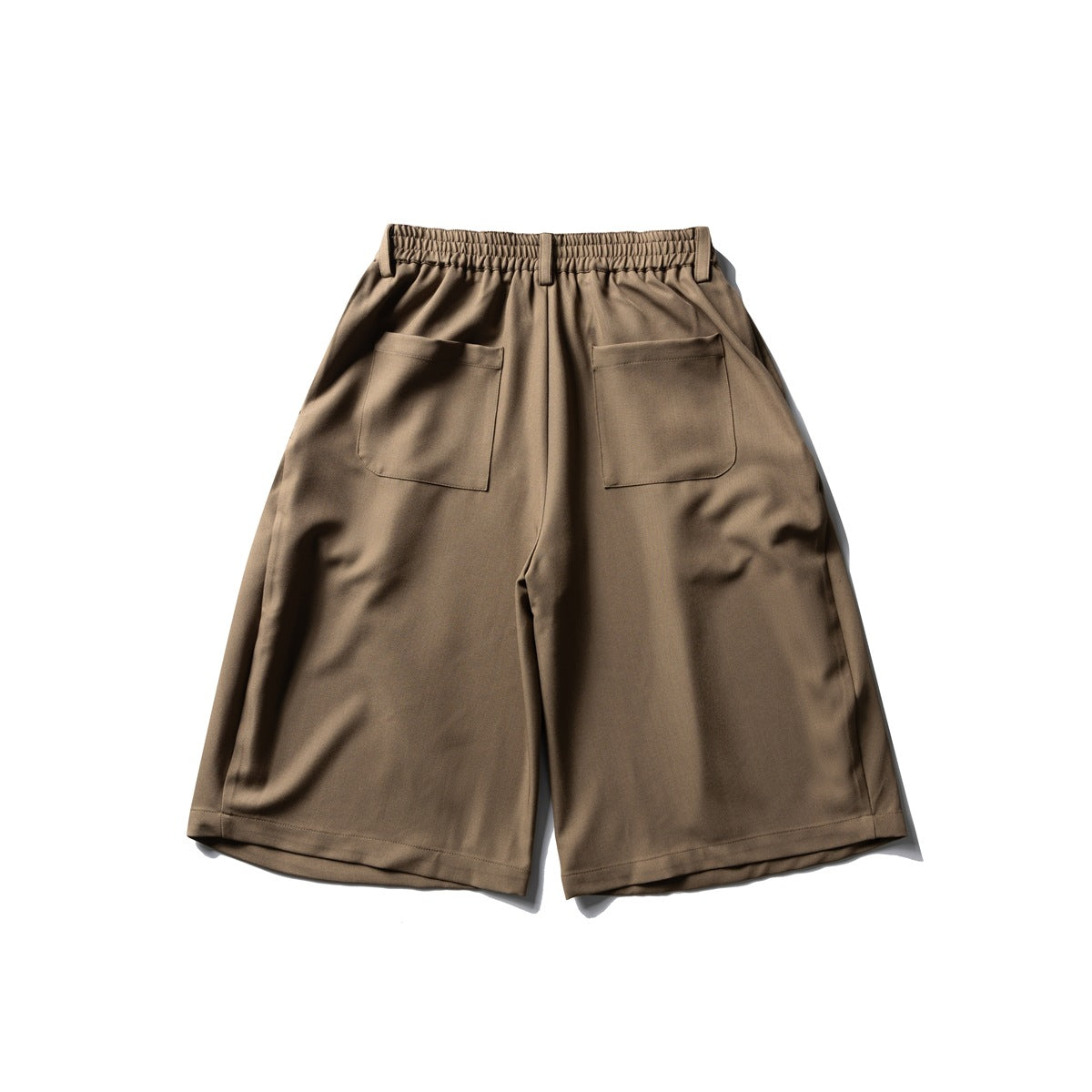 Back view of khaki wide-leg shorts with elastic waistband and two patch pockets, flat lay