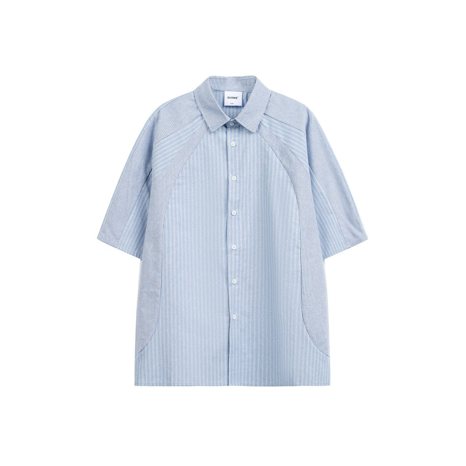 Front view of a light blue striped short-sleeve shirt with a collar, button placket, contrast panels, and side pockets.