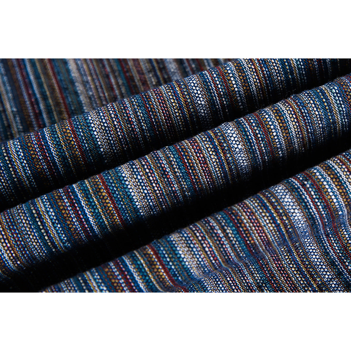 Close-up of dark woven fabric with fine blue, white, rust, and gray stripes.