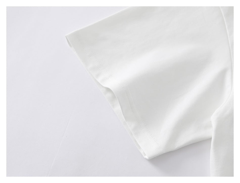 Close-up of a white T-shirt sleeve with a stitched hem.