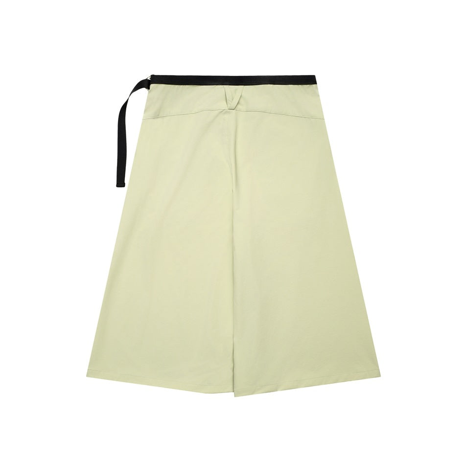 Pale yellow-green wrap-front skirt with a black webbing waist strap, shown flat against white.